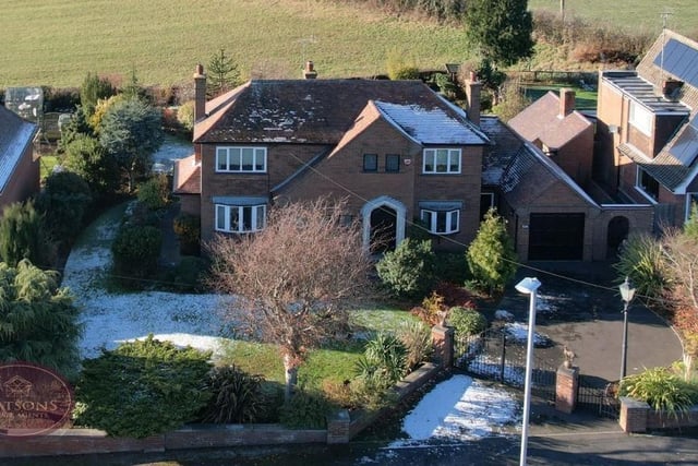 Our last image is an aerial shot from a drone, which shows how the impressive property sits on Nottingham Road. The front garden consists of a lawn, flowerbed borders, plants and shrubs.