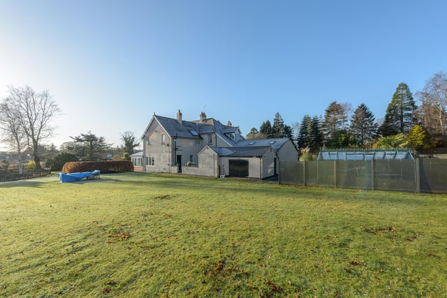The property boasts a substantial amount of beautiful garden spaces with gorgeous rose beds, raised wooded areas, various seating areas, a greenhouse and vegetable patch and pond amongst well maintained lawns.