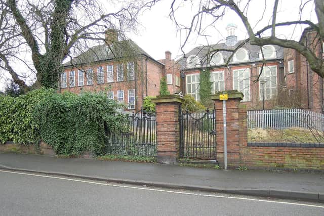 A council has taken ownership of a landmark former Derbyshire grammar school building in a bid to return it to its former glory.