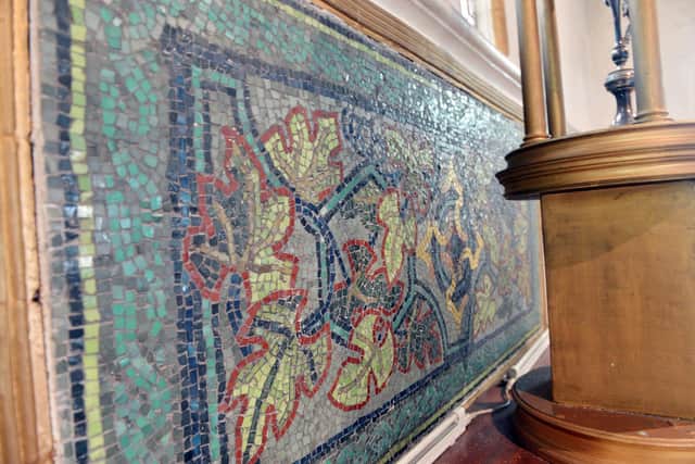 A mosaic by Richard Barry Parker and Sir Raymond Unwin inside the church.