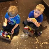 Beth's young sons enjoying their lunch boxes