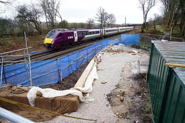 The project to restore Wingfield station has received a £667,000 grant from The National Lottery Heritage Fund. An EMR train passes the site at speed.