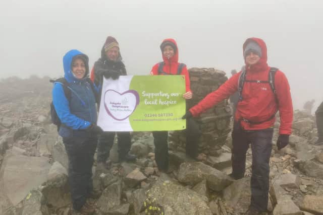 Hospice workers Georgie, Maurice, Laura and Andrew pictured at the top of Scafell Pike.