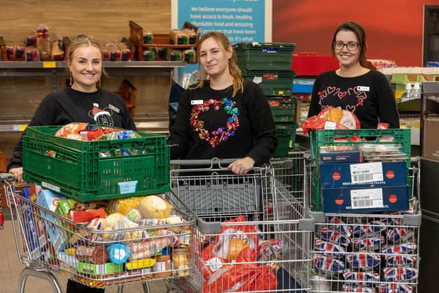 Aldi donated surplus food from all its stores to local charities and foodbanks when stores closed early on Christmas Eve. L-R: Emily Sutton,  Carla Louise Gospel and Tamara Mawson-Phipps (Aldi staff).
Credit: SWNS