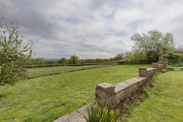 Gardens and an enclosed paddock linked to the property adjoin open countryside.