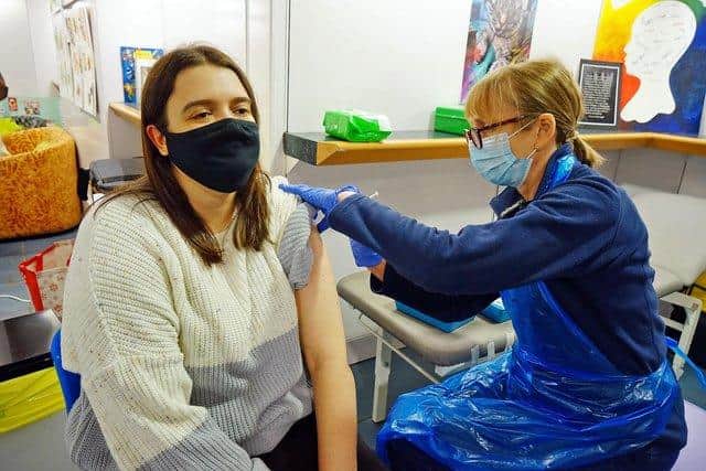 Rachel Thorley getting a job from nurse Carol Gavins at Chesterfield's mobile Covid vaccination clinic.