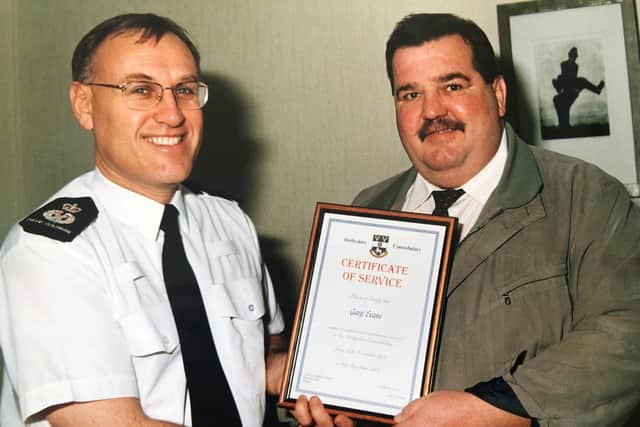 Gary Evans receiving a commendation from Chief Constable David Coleman