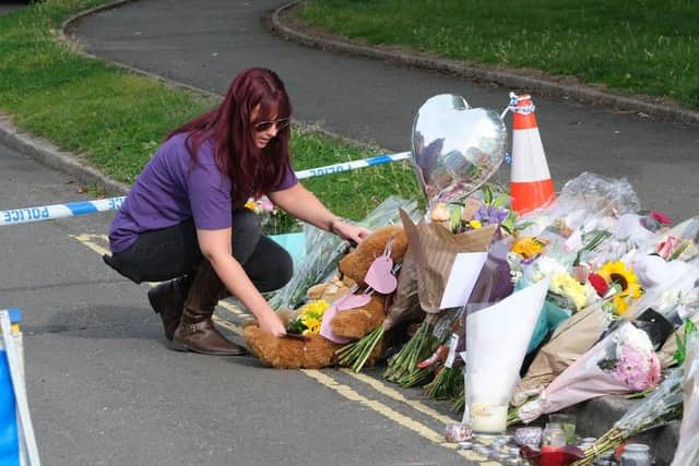 A sea of floral tributes was left in the Killamarsh street where a woman and three children were killed last month