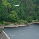An RAF Typhoon flies over the Derwent Dam in the Upper Derwent Valley on May 16, 2018 to mark the 100th anniversary of the Royal Air Force and the 75 anniversary of the 617 Squadron Dambusters operation during World War Two. (Photo by Ian Forsyth/Getty Images)