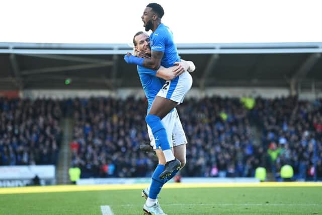 Tyrone Williams celebrates with Jamie Grimes after scoring Chesterfield's first equaliser.