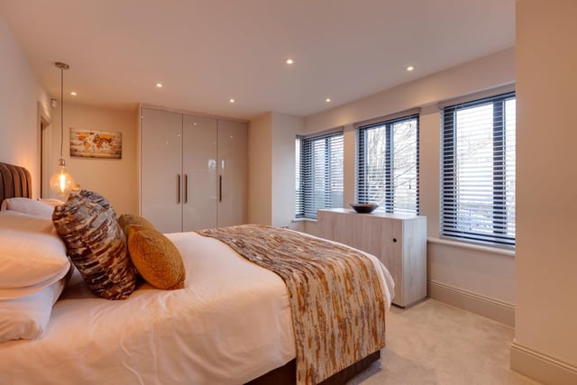 The master bedroom suite has a front-facing aluminium double glazed bay window, recessed lighting and under floor heating. There’s also a range of fitted furniture with wardrobes and a separate fitted rise/fall TV unit.