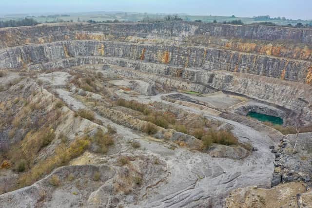 Inside the vast quarry with Crich Stand visible on the skyline.