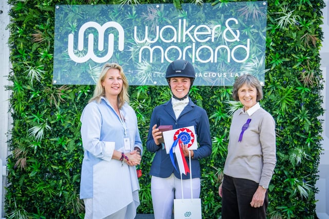 CCI2* Section B winner Emma Lawton receives her trophy from the Duchess of Devonshire and Susie Macarthur (left) of lead sponsor Walker & Morland.