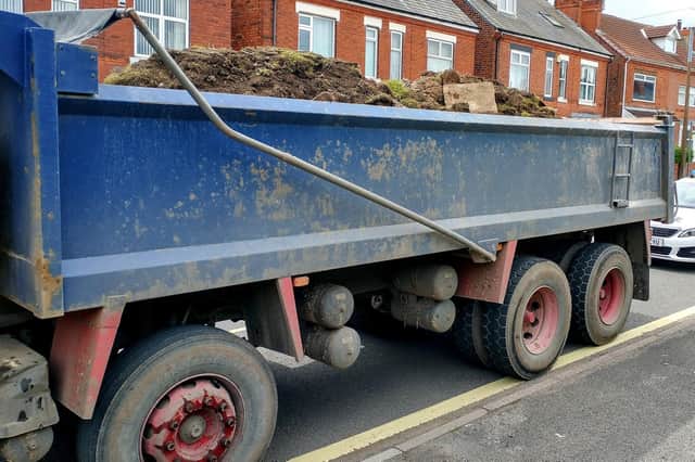 Officers in Shirebrook issued a fine to a truck driver transporting tonnes of soil and rubble without a safety net covering.