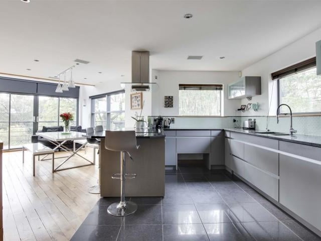 This room has full height double glazed windows and double glazed sliding doors providing access to the balcony.