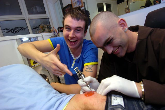 Nick Greenmount and Brett Carr got Comic Relief tattoos on their bums at Dragon tattoo Parlour Intake in 2009
