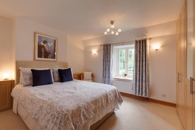 As with all the bedrooms, the third one comes complete with a range of fitted furniture, with shelves, drawers and cupboards. It overlooks the front of the £950,000 property.