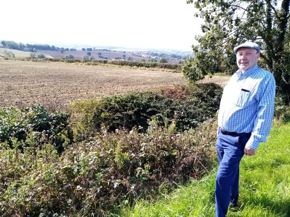Councillor Paul Jacobs at the site of the proposed new housing development.