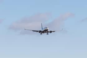 Boeing 737 landing on runway 27 at EMA airport