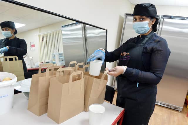 Chesterfield Asian Association has been running a lunchtime meals service since lockdown started. Tina Anusua packing the food bags.