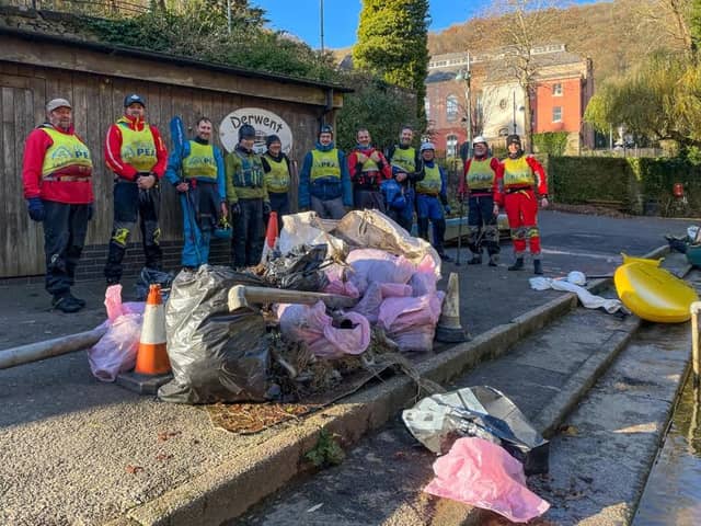 The band of volunteers with just some of the rubbish they fished from the Derwent.