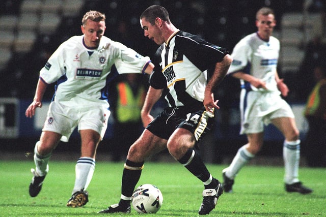 County's Andy Hughes takes on the Chesterfield defence in 1999.