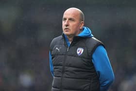 Paul Cook served a touchline ban against Torquay United on Saturday.