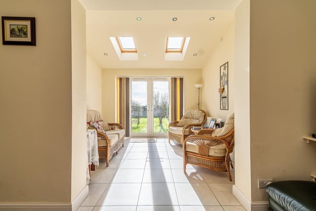 The lounge leads into the bright sun room, which forms part of the substantial ground-floor extension at the £185,000 property.