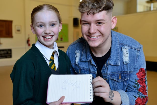 Michael Rice signs an autograph for St Aidan's Primary School pupil Mollie-Mae Jukes in 2018.