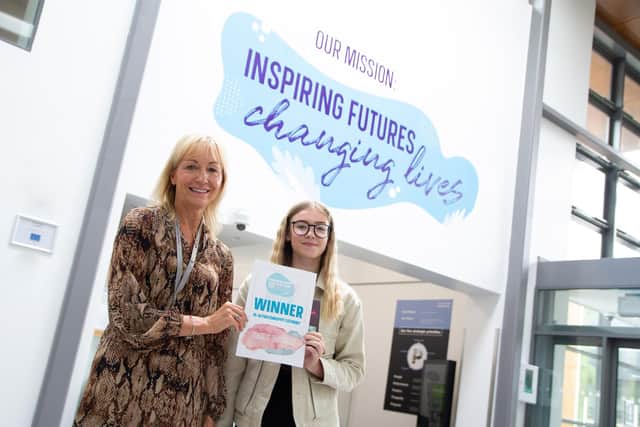Julie Richards (pictured front), Principal and Chief Executive of Chesterfield College presenting Emily Machin with her prize and certificate