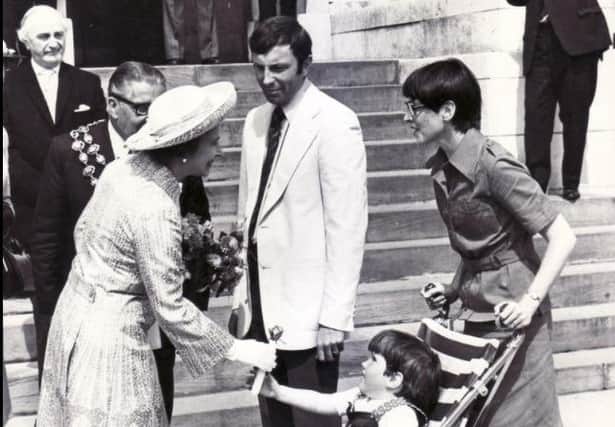 A  memorable moment for the little girl in this photo,  meeting the Queen on her visit to Chesterfield during the monarch's silver jubilee year.