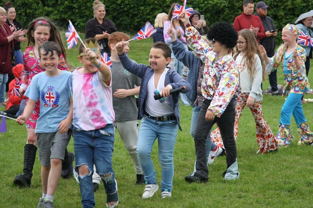 Pupils at Inkersall Spencer Academy pupils during the Jubilee fancy dress parade