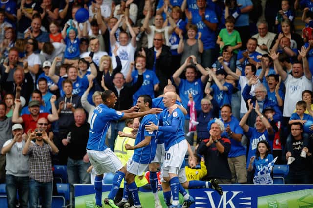 Jack Lester celebrates with Dwayne Mattis and Danny Whitaker after scoring in the win against Gillingham in May 2011 which secured the League Two title for the Spireites.