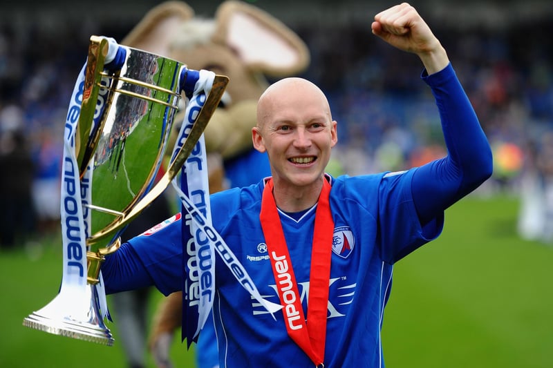 Danny Whitaker celebrates with the trophy after being crowned champions.