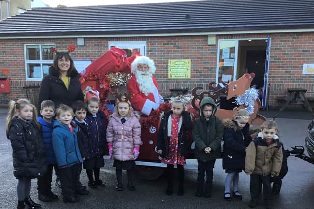 The school's own Santa visited the children via the sleigh in the school playground, giving each child a gift.