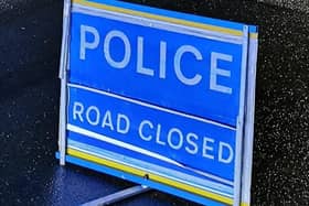 Policve have closed the road after a crash