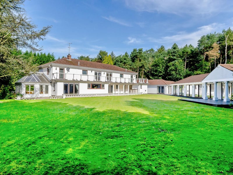 The gardens extend to 2.5 acres and feature a large patio, woodland and a central feature pond
