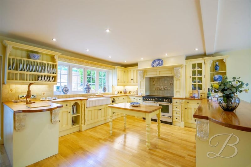 The impressive kitchen diner comes complete with traditional cabinets and units, work surface, sink and drainer with a mixer tap above, and double integral ovens. There is a window at the back, a cupboard for additional storage and central heating radiators.