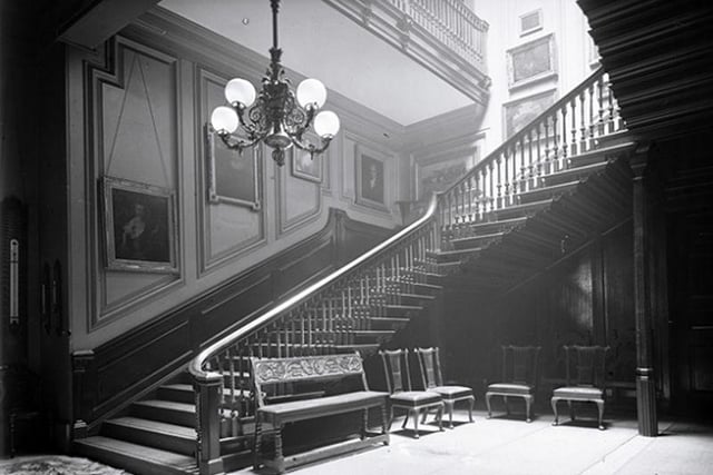 The staircase and hallway at Sutton Scarsdale Hall in 1919.