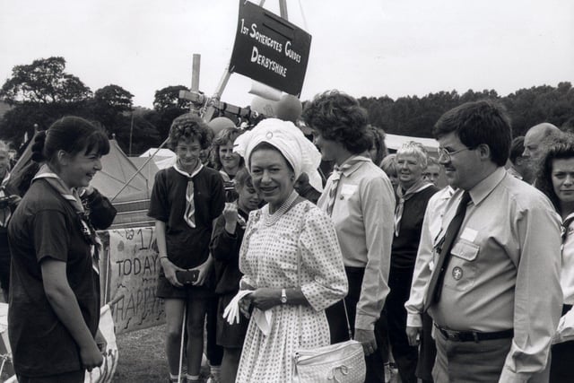 Princess Margaret spending time chatting with guides at Peak 90, the international scout and guide camp held at Chatsworth in 1990.