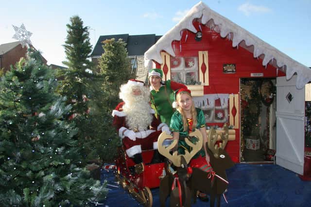 Sarah, Santa and Sparkle the elf pictured at the North Pole Experience in Codnor