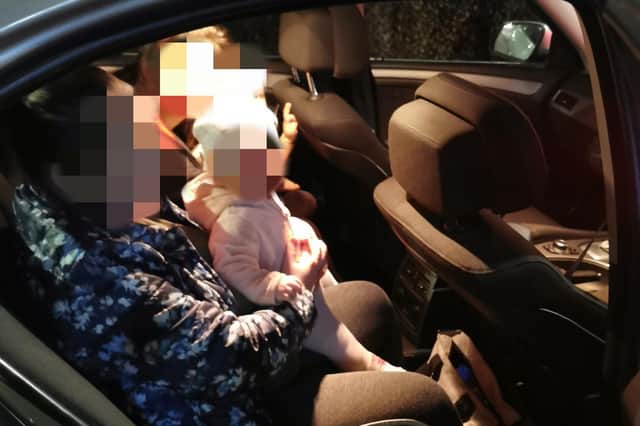 The speeding car had babies in the back, sitting on passengers' laps.