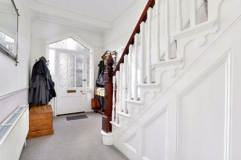Clean white decor in the entrance hall creates an excellent first impression.