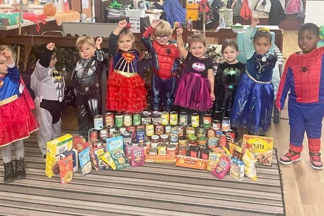The Harvest Heroes standing tall with their super food bank donation. Photo: Heanor pre-school