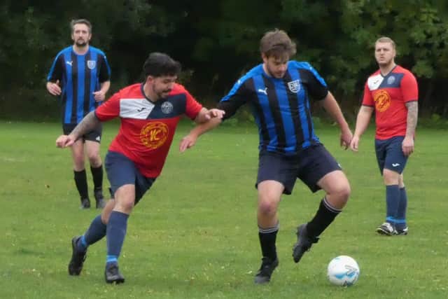 Dronfield Wanderers (stripes) got their first win of the season at Clay Cross United. Pic by Martin Roberts.