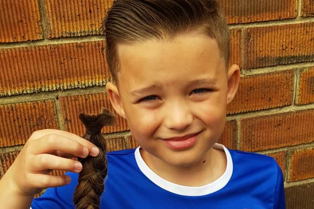 Todd Findlay, 7, has raised nearly £900 for the Steven Miller Foundation by chopping his hair off.