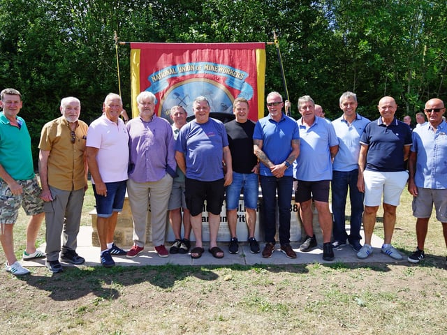 Former miners and school friends attend the unveiling ceremony.