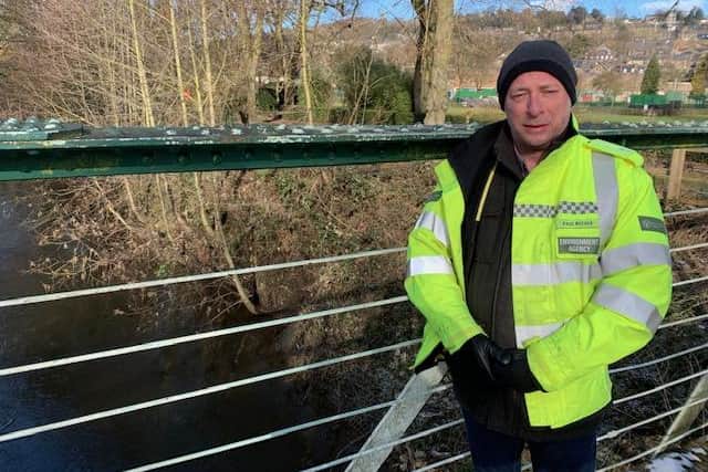 The Environment Agency's Paul Reeves by the River Derwent in Matlock.