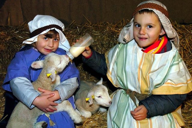 Melissa Grafton and Joshua Savage feed the new born lambs at Totley Hall Farm dressed as Mary and Joseph from the nativity play in 2005