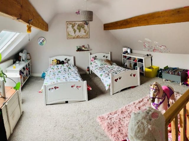There is another bedroom on the second floor.
